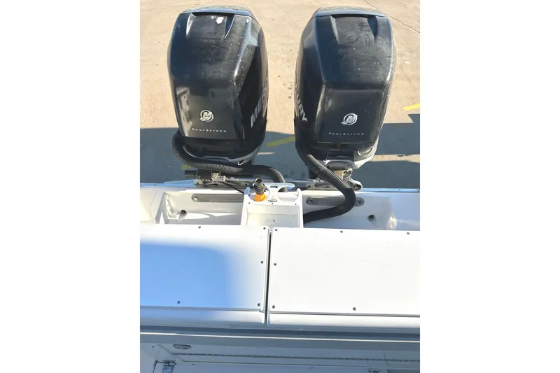 Slide: The Image of 2006 Southport 26 Center Console with dual Mercury outboard engines. - 13