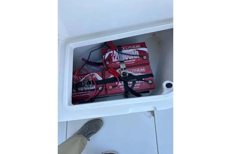 Slide: The Image of Lithium batteries in storage compartment of 2006 Southport 26 Center Console boat. - 18