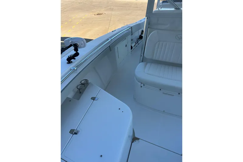 Slide: The Image of 2006 Southport 26 Center Console boat interior with seating and storage compartments. - 20