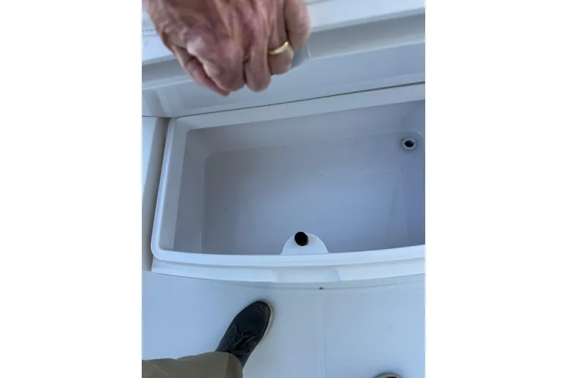 Slide: The Image of Open storage compartment on 2006 Southport 26 Center Console boat. - 21