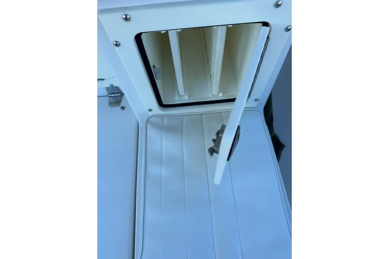 Slide: The Image of Open storage compartment on 2006 Southport 26 Center Console boat. - 25