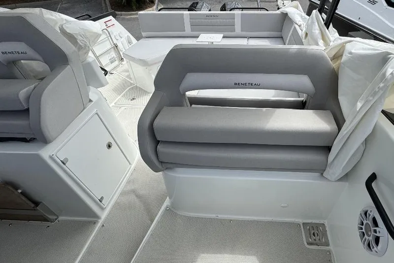 Slide: The Image of 2024 Beneteau Flyer 10 interior with gray seating and modern design. - 10