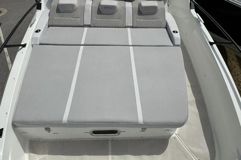 Slide: The Image of 2024 Beneteau Flyer 10 boat with spacious gray sunbed seating. - 11