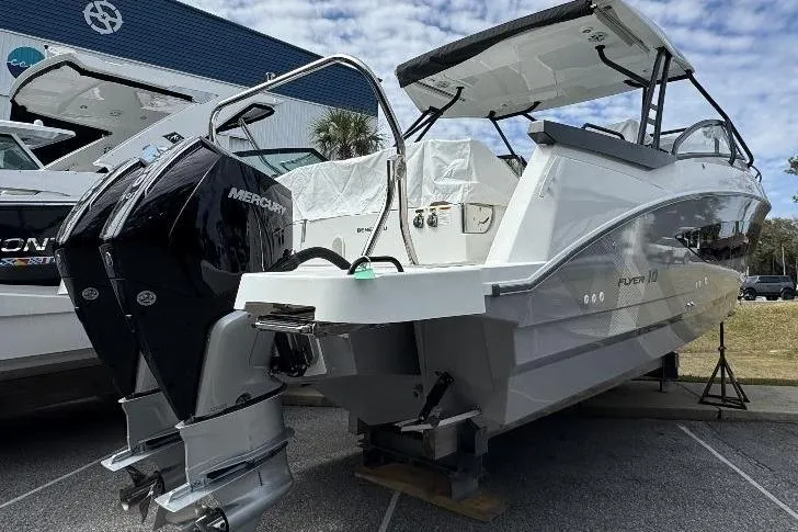 Slide: The Image of 2024 Beneteau Flyer 10 boat with dual Mercury engines, displayed outdoors. - 4
