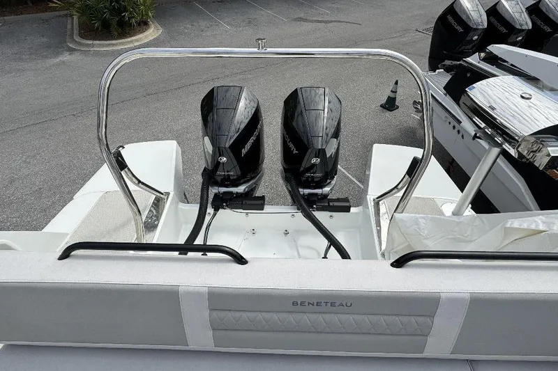 Slide: The Image of 2024 Beneteau Flyer 10 boat with dual Mercury outboard engines, rear view. - 5