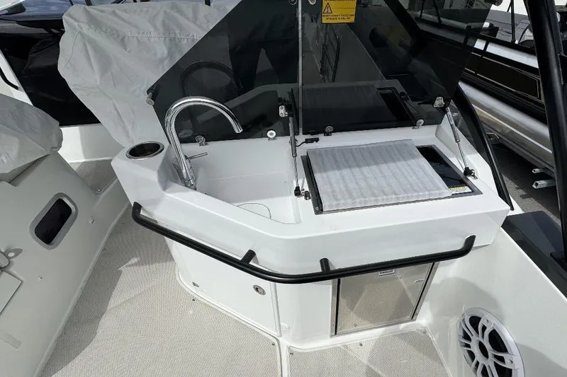 Slide: The Image of 2024 Beneteau Flyer 10 boat interior with sink and storage area. - 7