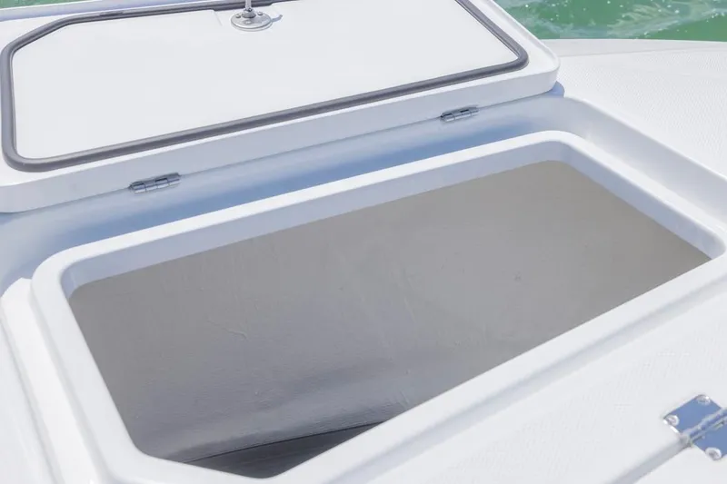 Slide: The Image of Open storage compartment on 2026 Invincible 36 Catamaran, showcasing spacious interior. - 16