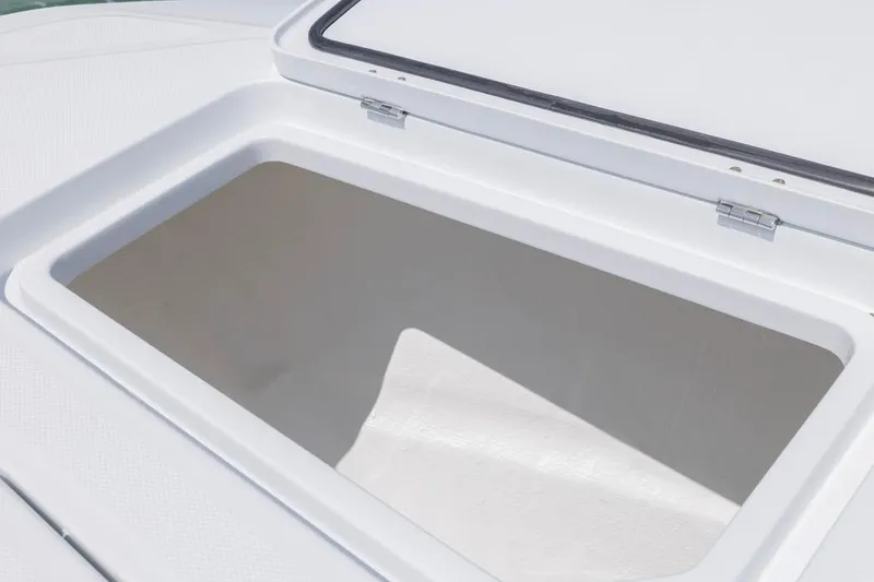 Slide: The Image of Open storage compartment on 2026 Invincible 36 Catamaran boat deck. - 17