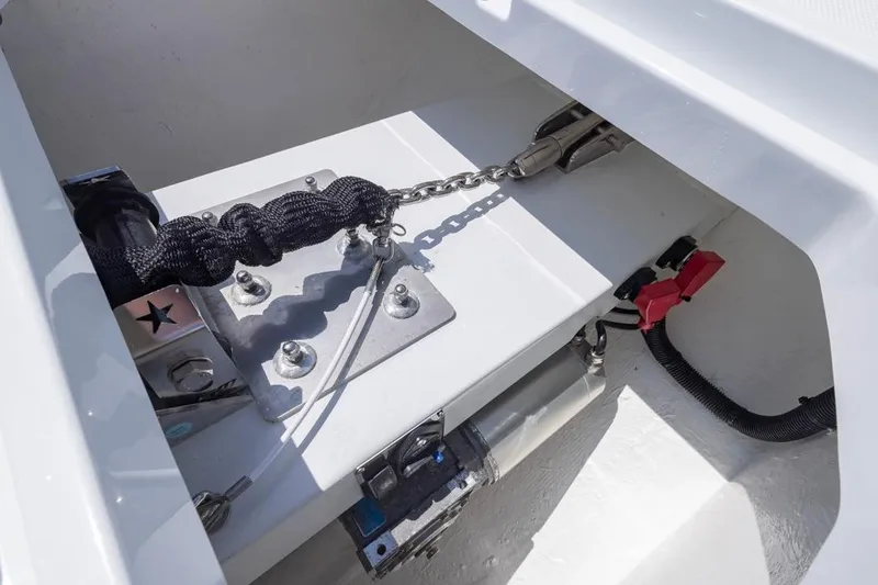 Slide: The Image of Anchor compartment of 2026 Invincible 36 Catamaran with chain and securing mechanism. - 18
