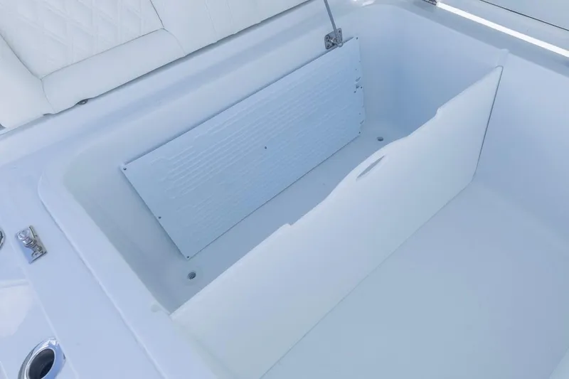 Slide: The Image of Storage compartment of 2026 Invincible 36 Catamaran, featuring a sleek white interior design. - 22