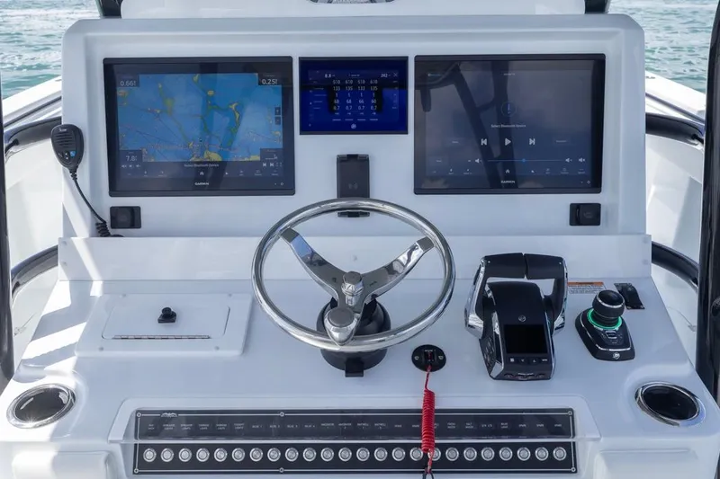 Slide: The Image of Helm of 2026 Invincible 36 Catamaran with advanced navigation and control systems. - 28