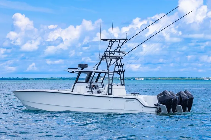 Slide: The Image of 2026 Invincible 36 Catamaran on open water, featuring triple outboard engines. - 3