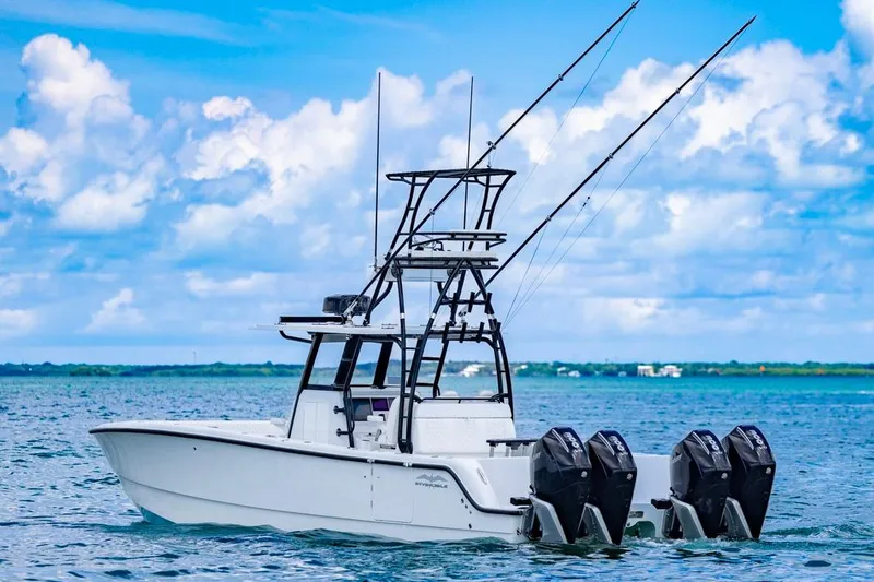 Slide: The Image of 2026 Invincible 36 Catamaran on open water, featuring multiple outboard engines. - 4