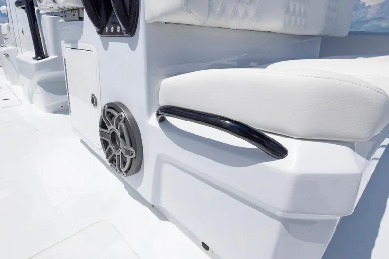 Slide: The Image of 2026 Invincible 36 Catamaran interior detail with speaker and cushioned seating. - 41