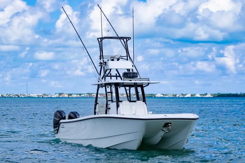 Slide: The Image of 2026 Invincible 36 Catamaran on open water, clear sky, dual engines visible. - 5