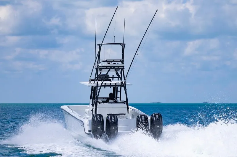 Slide: The Image of 2026 Invincible 36 Catamaran cruising on open ocean with powerful engines. - 53