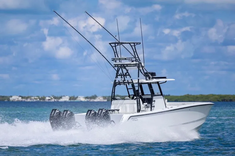 Slide: The Image of 2026 Invincible 36 Catamaran speeding on blue ocean waters under a clear sky. - 56