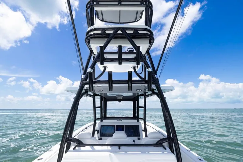 Slide: The Image of 2026 Invincible 36 Catamaran on open sea under clear blue sky. - 8