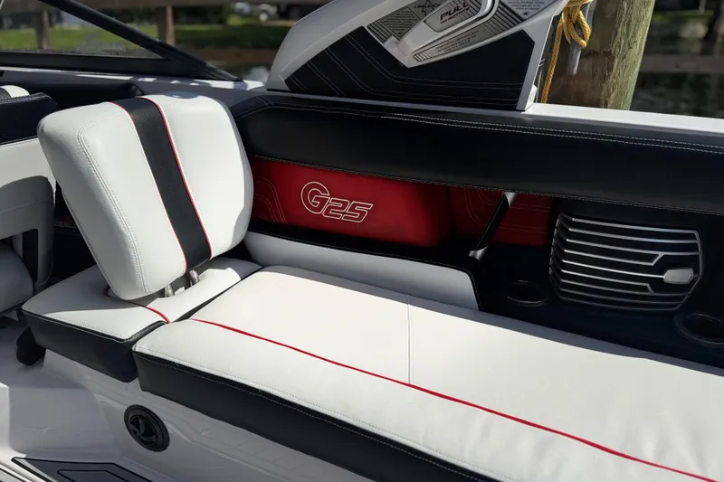 Slide: The Image of 2015 Nautique Super Air Nautique G25 Coastal Edition interior with stylish seating and speaker. - 10