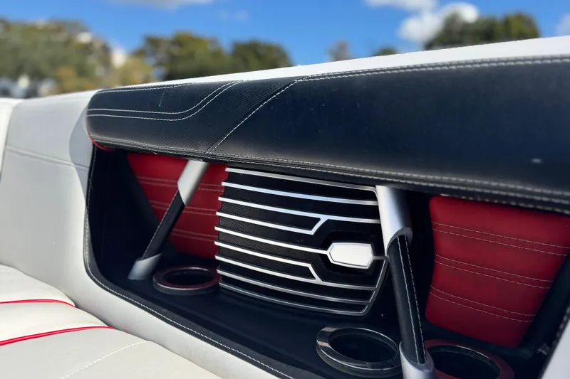 Slide: The Image of 2015 Nautique Super Air Nautique G25 Coastal Edition interior detail with stylish seating and cup holders. - 11