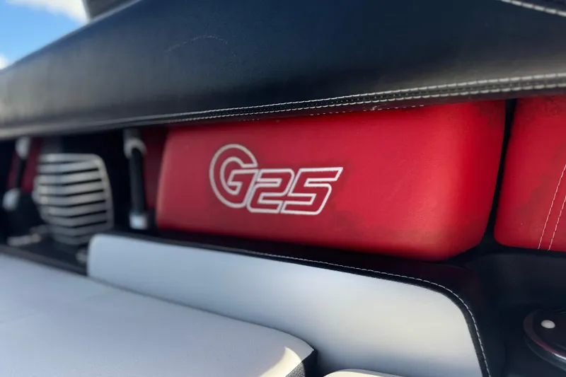Slide: The Image of 2015 Nautique Super Air Nautique G25 Coastal Edition interior detail with red G25 logo. - 12
