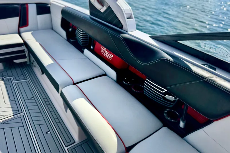Slide: The Image of 2015 Nautique Super Air Nautique G25 Coastal Edition interior with sleek seating and cup holders. - 16
