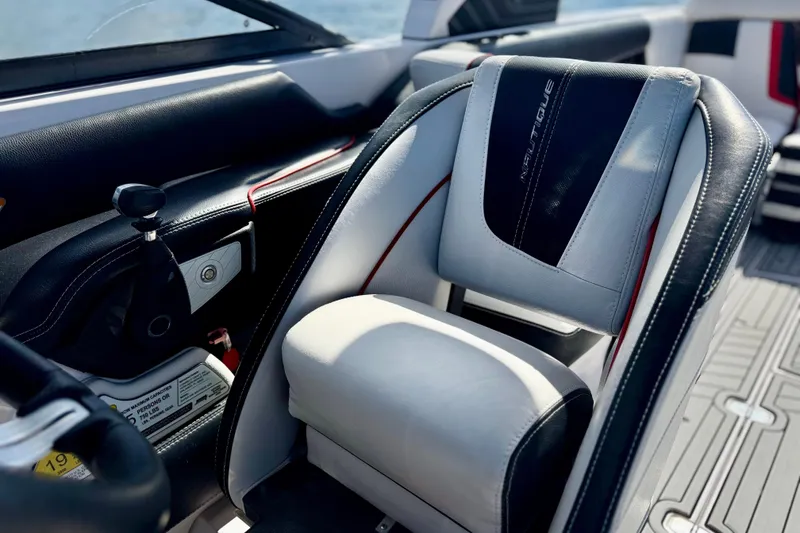 Slide: The Image of 2015 Nautique Super Air Nautique G25 Coastal Edition interior with sleek seating and controls. - 4