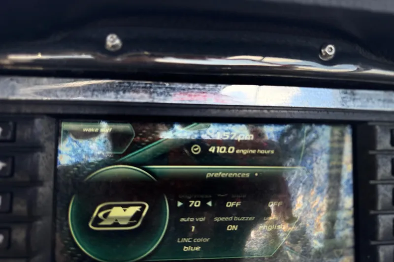 Slide: The Image of Dashboard of 2015 Nautique Super Air Nautique G25, showing 410 engine hours. - 6