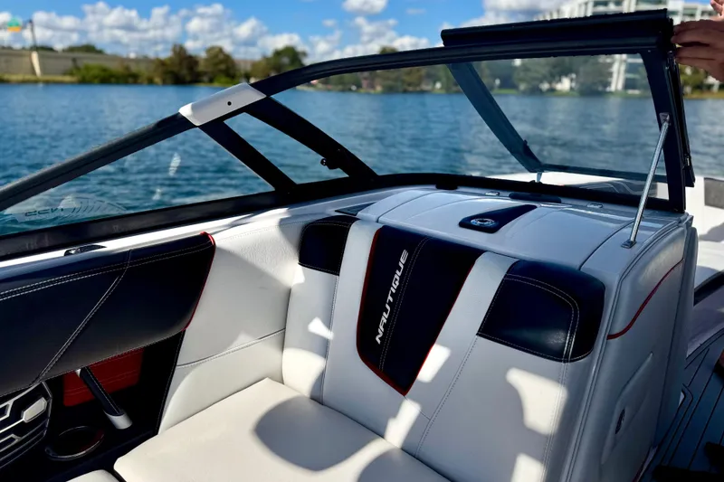 Slide: The Image of 2015 Nautique Super Air Nautique G25 Coastal Edition interior with lake view. - 9