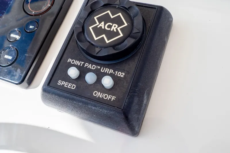Slide: The Image of Control panel of 2015 Intrepid 327 Cuddy boat with ACR Point Pad URP-102. - 17