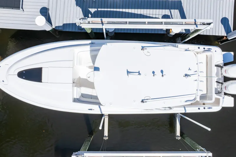 Slide: The Image of Overhead view of a 2015 Intrepid 327 Cuddy boat docked at a marina. - 29