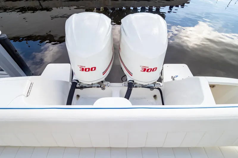 Slide: The Image of 2015 Intrepid 327 Cuddy with twin Yamaha 300 engines on calm water. - 37