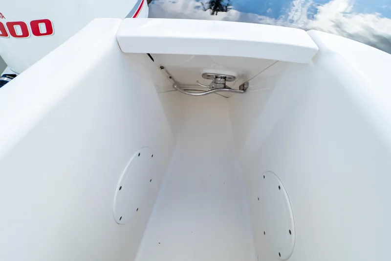 Slide: The Image of 2015 Intrepid 327 Cuddy boat storage compartment with stainless steel hardware. - 39