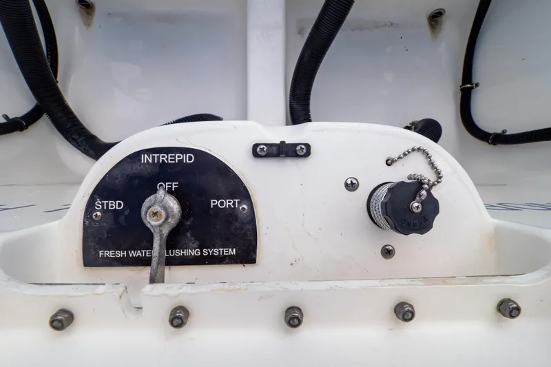 Slide: The Image of Control panel of 2015 Intrepid 327 Cuddy boat's fresh water flushing system. - 41