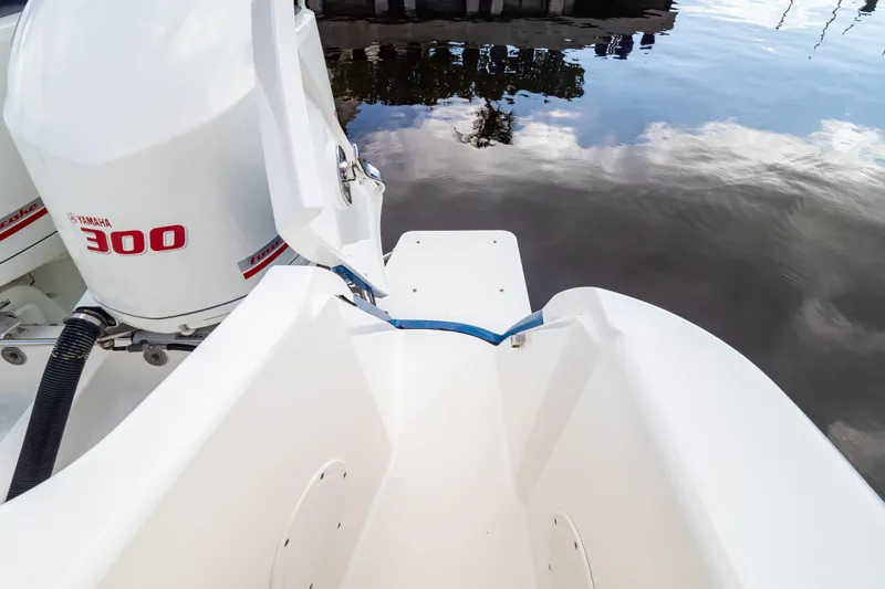 Slide: The Image of 2015 Intrepid 327 Cuddy boat with Yamaha 300 engine on calm water. - 42