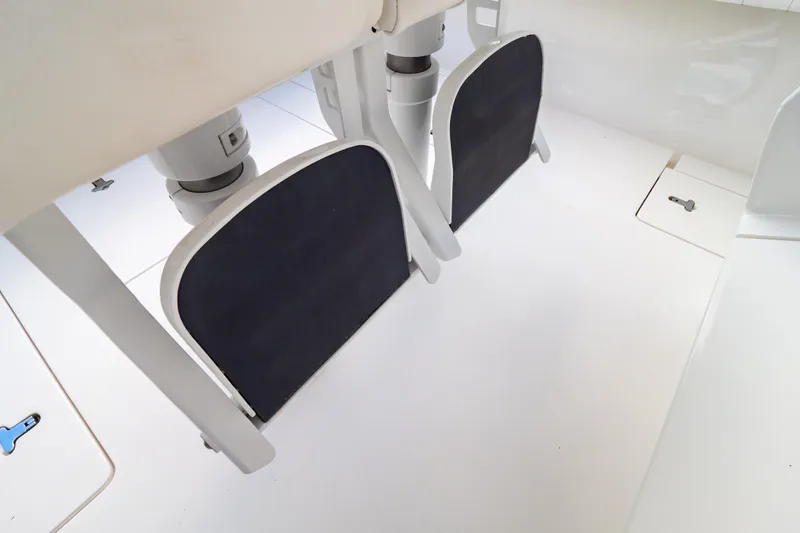 Slide: The Image of 2015 Intrepid 327 Cuddy boat interior with footrests and clean white deck. - 56