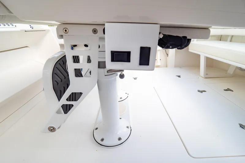 Slide: The Image of 2015 Intrepid 327 Cuddy interior detail showcasing seating and deck features. - 57