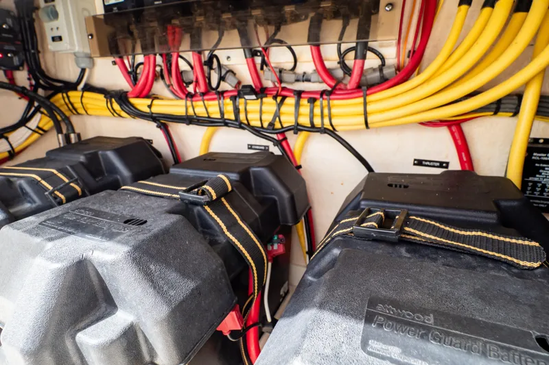 Slide: The Image of Electrical system of a 2015 Intrepid 327 Cuddy with organized wiring and battery setup. - 66