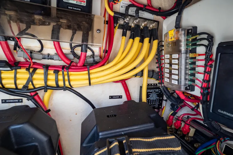 Slide: The Image of Electrical wiring and components inside a 2015 Intrepid 327 Cuddy boat. - 67
