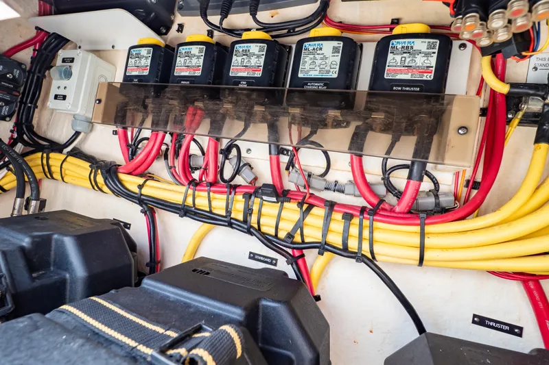 Slide: The Image of Electrical wiring and components inside a 2015 Intrepid 327 Cuddy boat. - 68