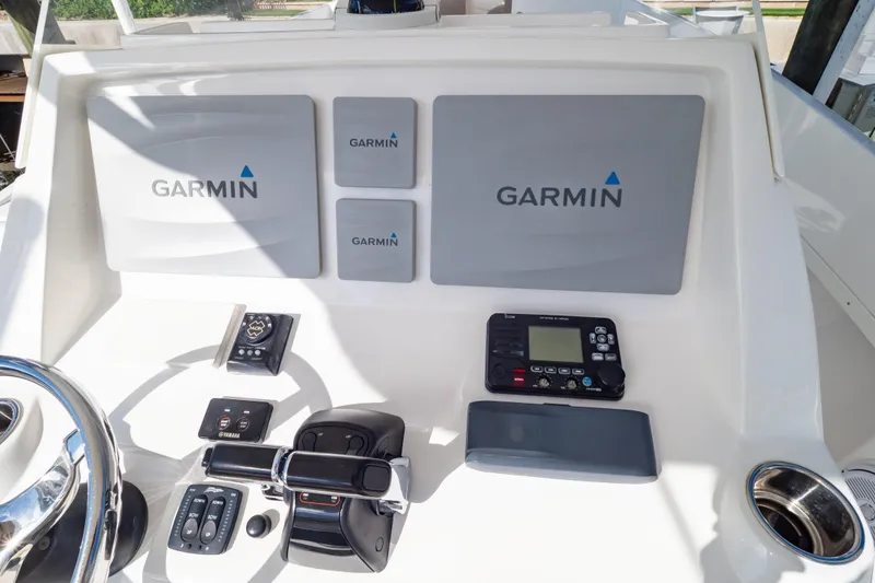 Slide: The Image of Control panel of a 2015 Intrepid 327 Cuddy with Garmin navigation equipment. - 87