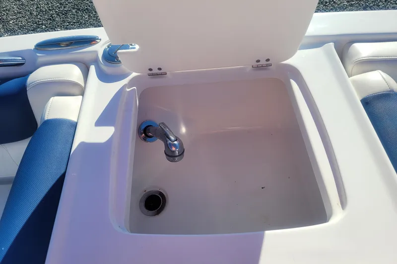 Slide: The Image of 2017 Tahoe 2150 boat sink with faucet and blue seating. - 14