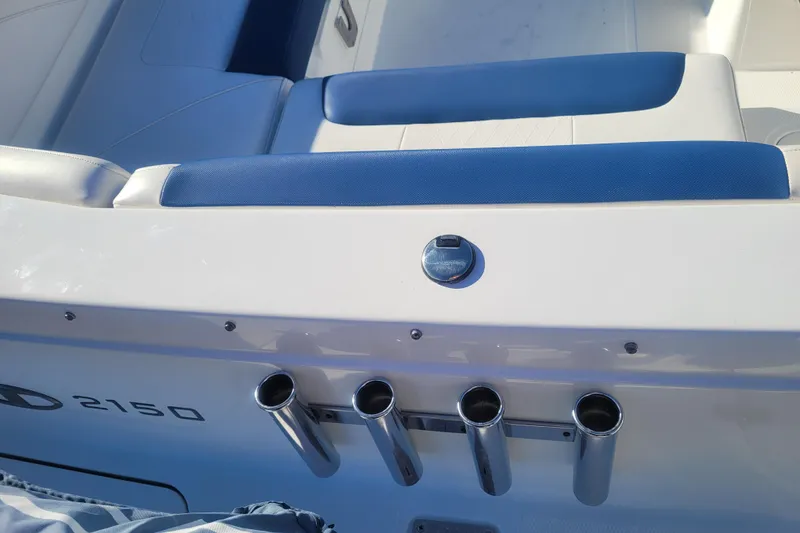 Slide: The Image of 2017 Tahoe 2150 boat interior with blue seating and rod holders. - 7