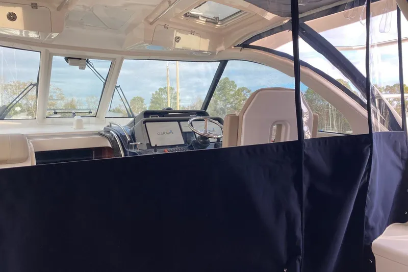 Slide: The Image of 2015 Pursuit OS 385 Offshore boat on stands in a marina yard. - 2