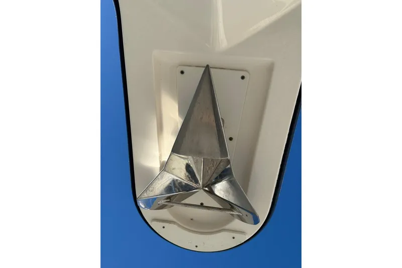 Slide: The Image of 2015 Pursuit OS 385 Offshore boat anchor detail against blue sky. - 4