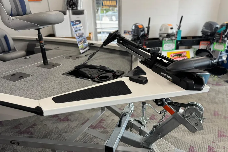 Slide: The Image of 2025 G3 Sportsman 1610 boat with Minn Kota trolling motor on display. - 1