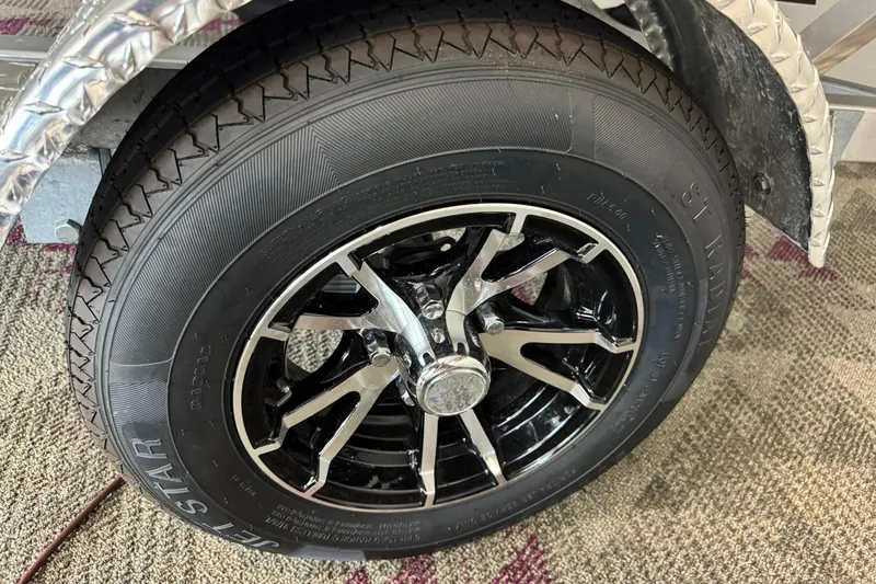 Slide: The Image of 2025 G3 Sportsman 1610 wheel with black alloy rim and radial tire. - 5