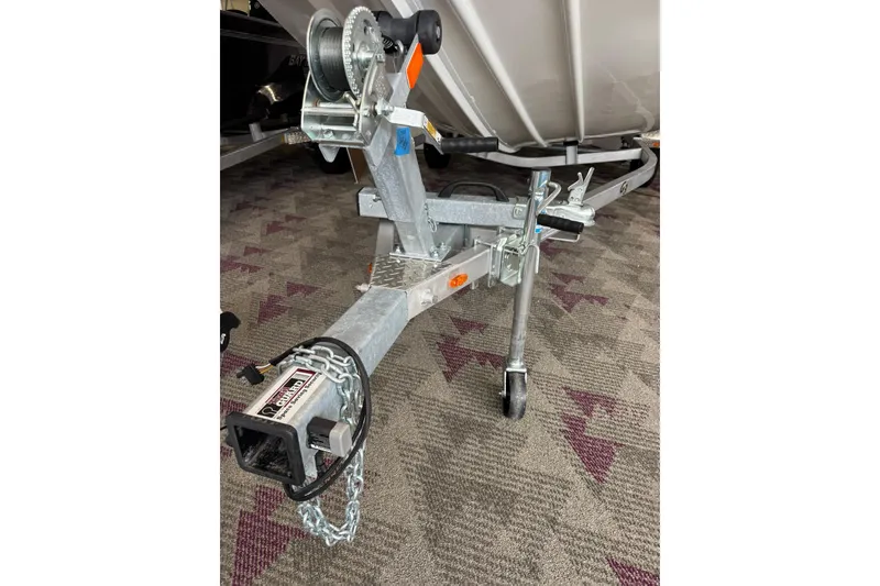 Slide: The Image of Trailer hitch of 2025 G3 Sportsman 1610 boat, featuring a sturdy winch and chain. - 6