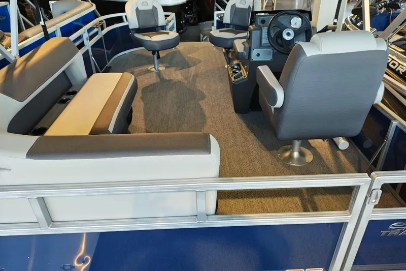 Slide: The Image of 2026 Sun Tracker Bass Buggy 16 XL Select interior with seating and steering console. - 11