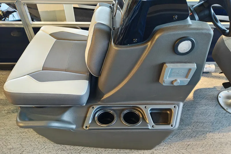 Slide: The Image of 2026 Sun Tracker Bass Buggy 16 XL Select boat interior with seating and cup holders. - 7